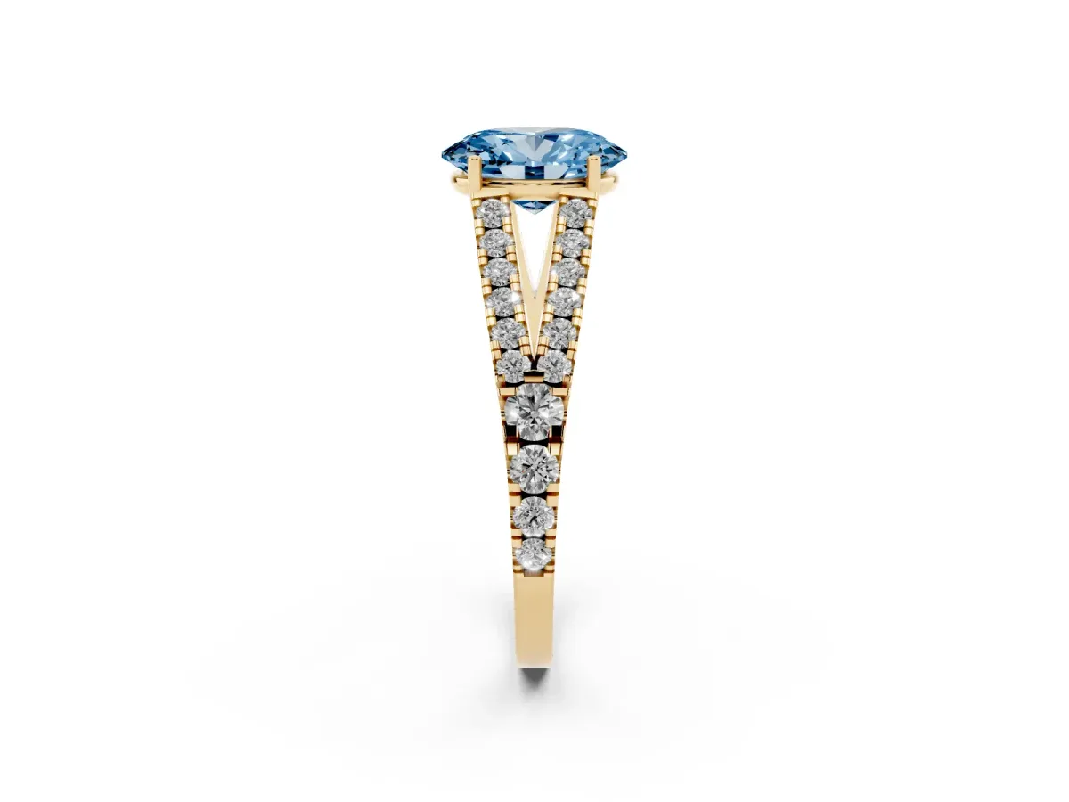 Fancy Blue Oval Cut Diamond Split Shank Engagement Ring with Round Pavé and Prong Setting Yellow gold