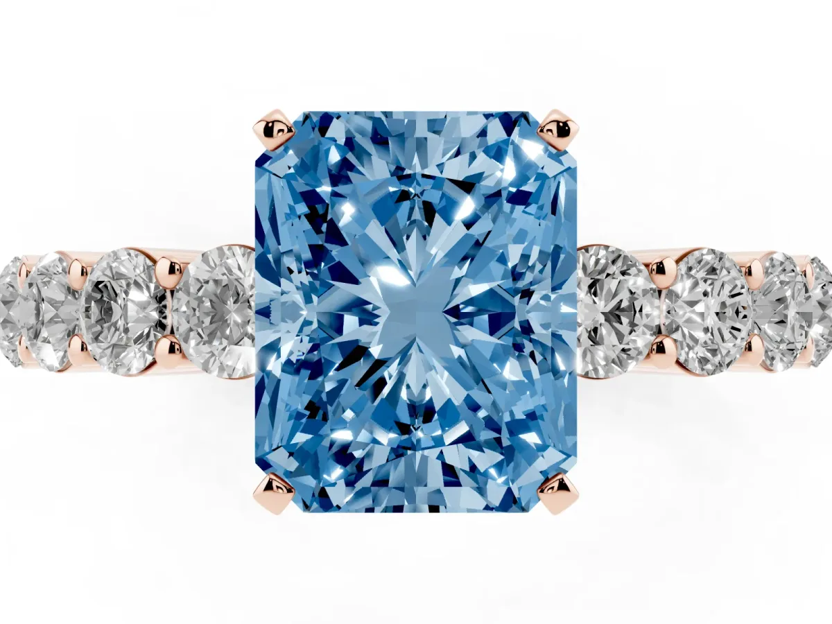 Fancy Blue Radiant Cut Diamond Solitaire Ring with Shared Prong Round Side Stones Rose gold