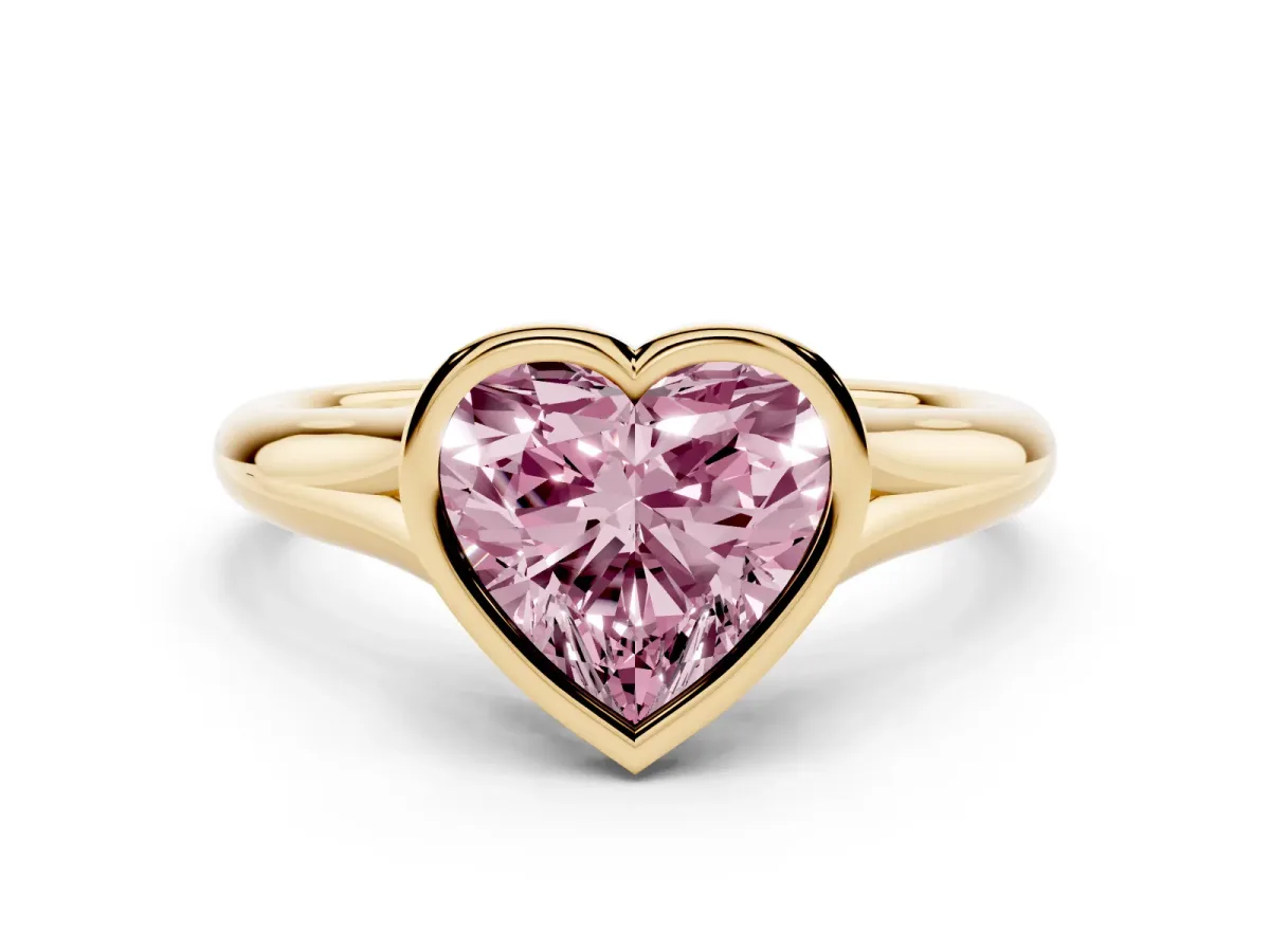 Fancy Pink Bezel Set Heart Cut Solitaire Diamond Ring with Smooth Band Yellow gold