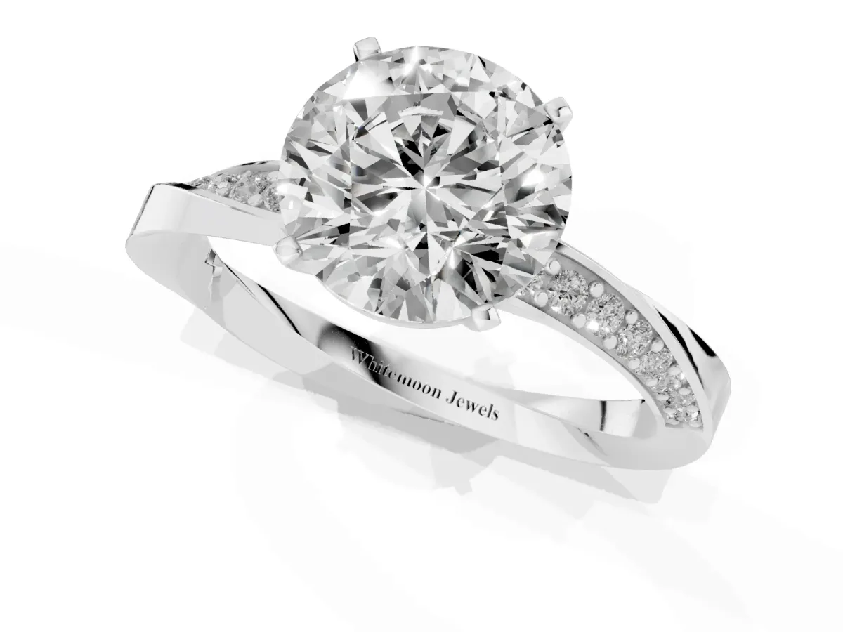 Round Cut Diamond Engagement Ring with Side Stone Accents and Four-Prong Setting Silver