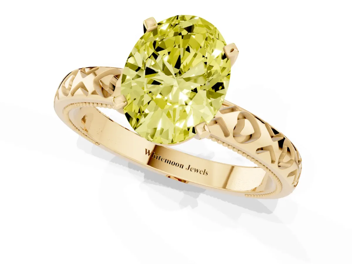 Fancy Yellow Oval Cut Solitaire Diamond Engagement Ring with XO Engraved Band and Four-Prong Setting Yellow gold