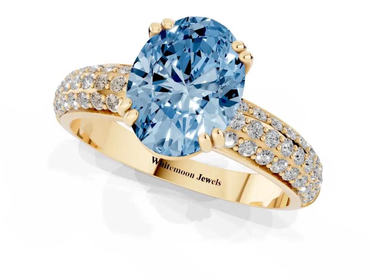Fancy Blue Oval Cut Diamond Solitaire Ring with Multi-Row Round Pavé Band and Prong Setting Yellow gold