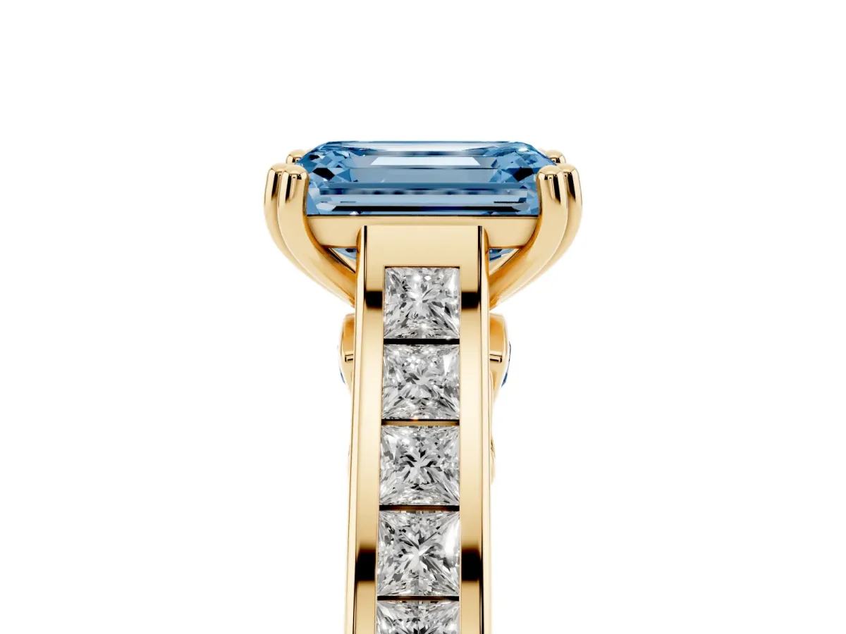 Fancy Blue Emerald Cut Cut Channel Set Solitaire Engagement Ring with Prong Setting Yellow gold