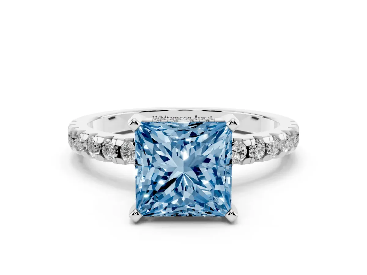 Fancy Blue Princess Cut Diamond Solitaire Ring with Round Pavé Band and Four-Prong Setting Silver