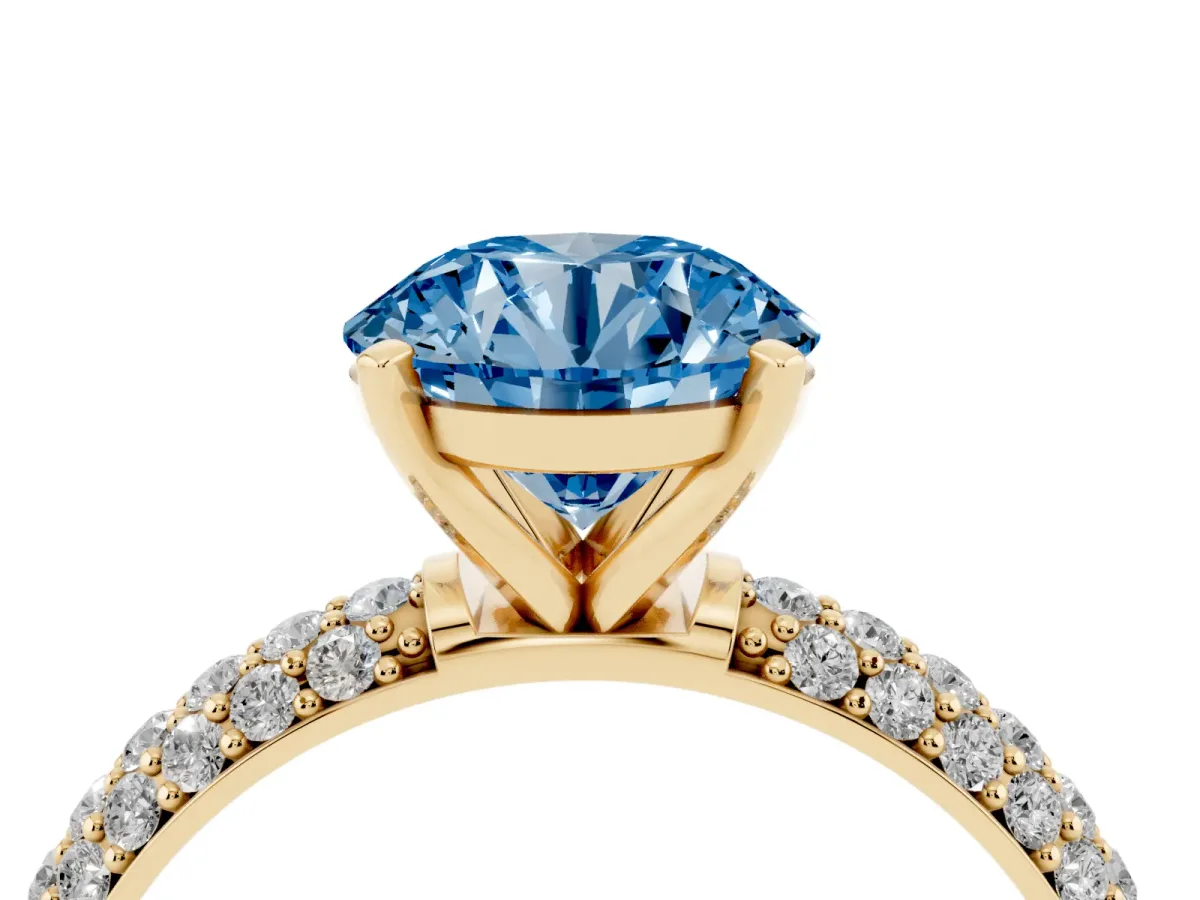 Fancy Blue Round Cut Diamond Solitaire Ring with Prong Setting and Pavé Band Yellow gold