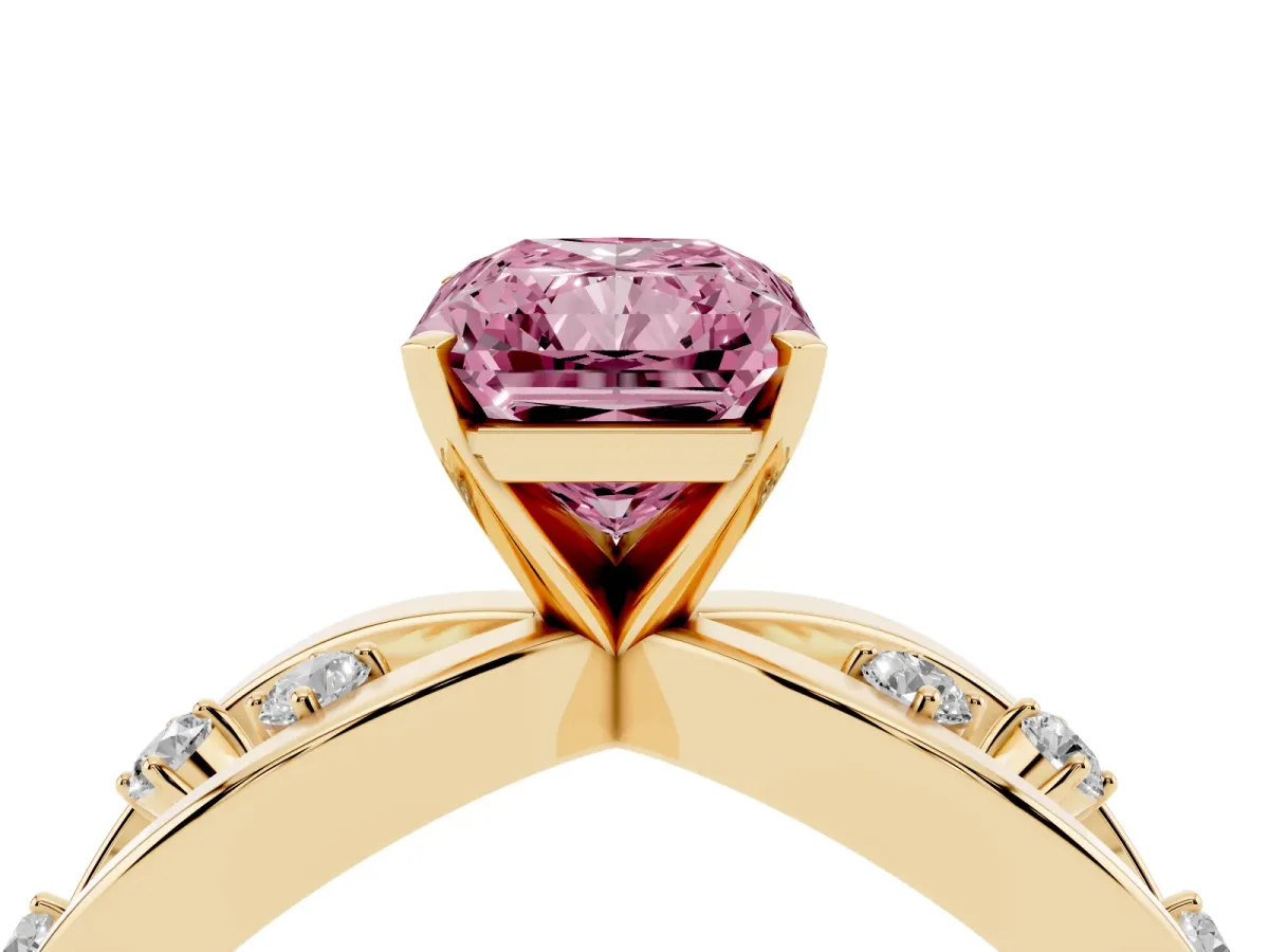 Fancy Pink Radiant Cut Cut Solitaire Diamond with Side Stones on Criss-Cross Band and Four-Prong Setting Yellow gold