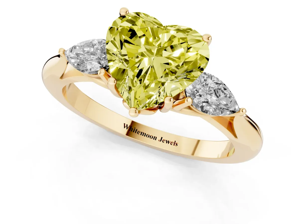 Fancy Yellow Three-Stone Heart Cut Diamond Ring with Pear Side Stones in Four-Prong Setting Yellow gold