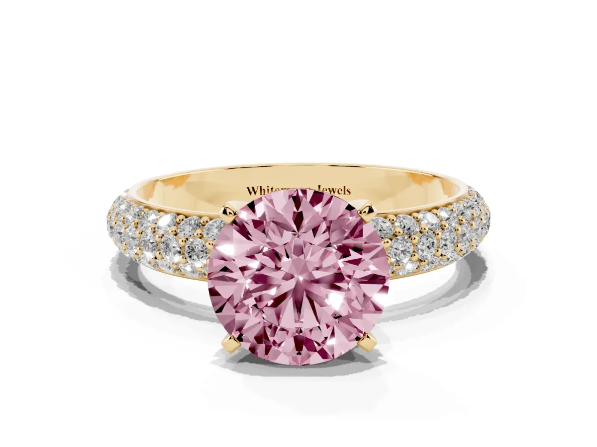 Fancy Pink Round Cut Diamond Solitaire Ring with Prong Setting and Pavé Band Yellow gold