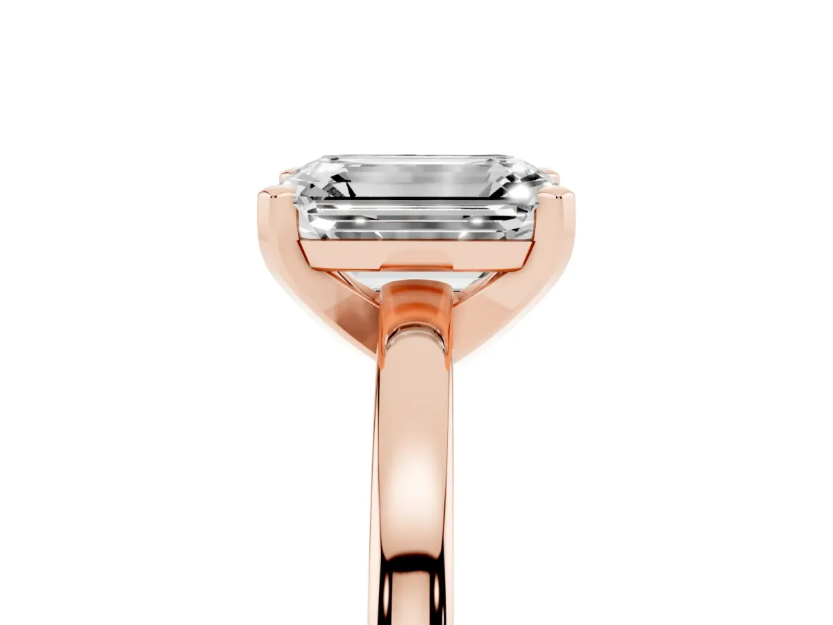 Emerald Cut Solitaire Diamond Engagement Ring with Four-Prong Setting on a Classic Band Rose gold