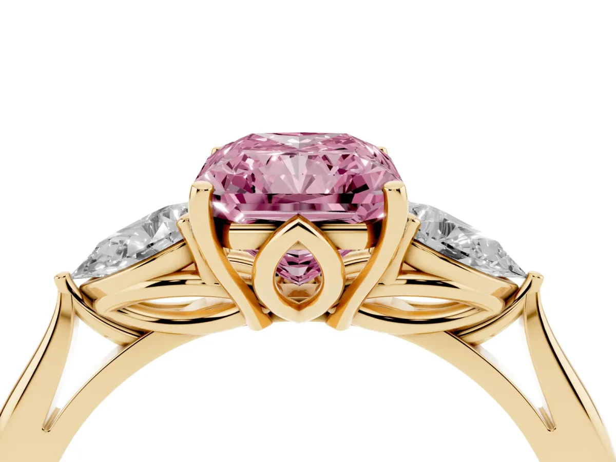 Fancy Pink Three-Stone Radiant Cut Diamond Ring with Pear Side Stones in Four-Prong Setting Yellow gold