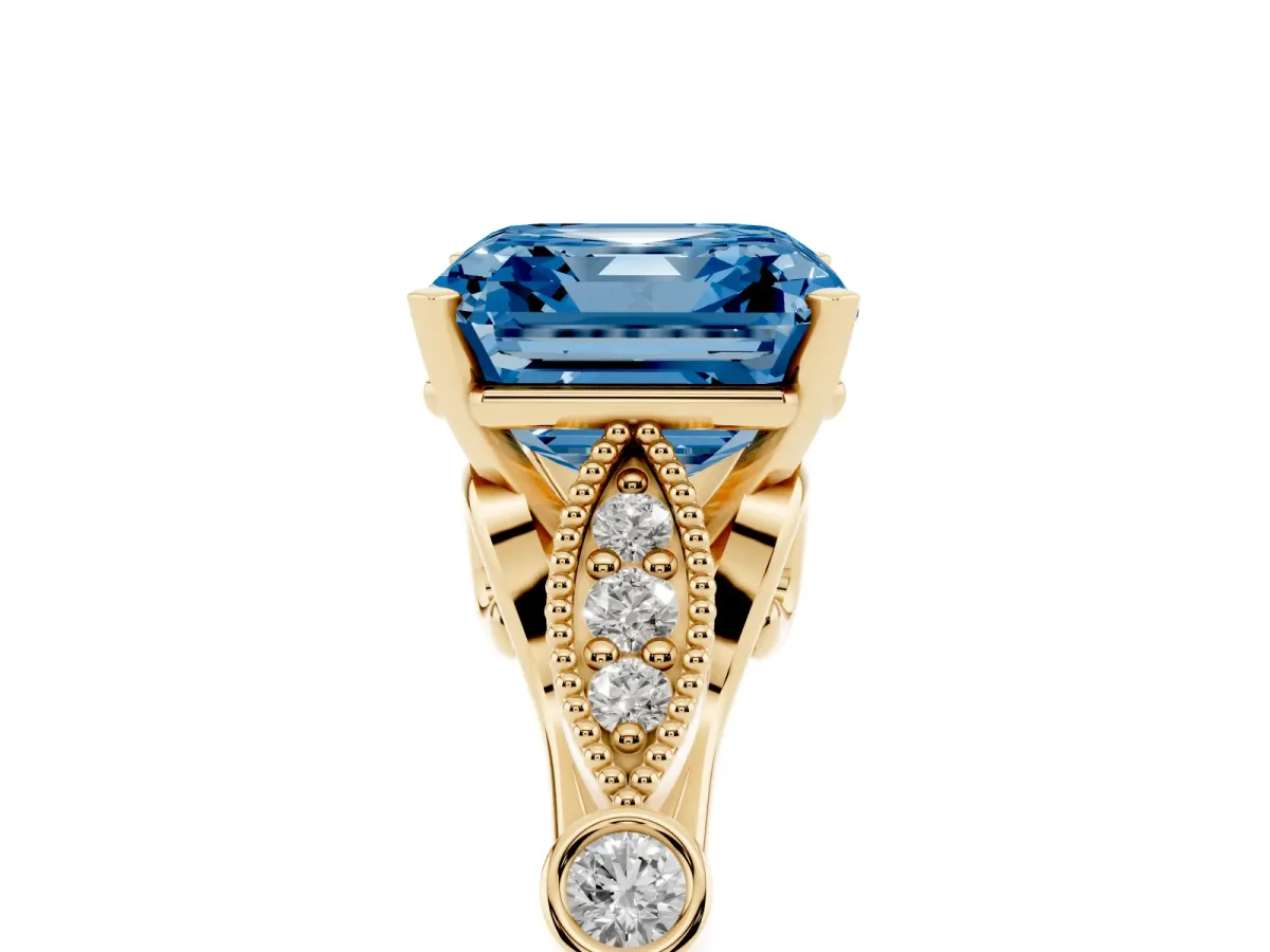 Fancy Blue Asscher Cut Cut Diamond with Milgrain Marquise and Bezel Accents on a Solitaire Band with Prong Setting Yellow gold