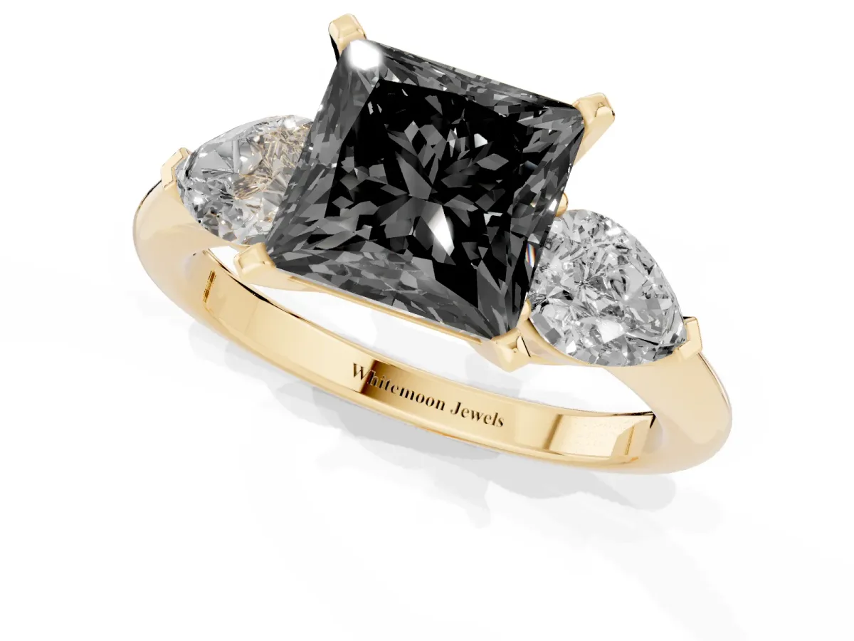 Fancy Black Three-Stone Princess Cut Diamond Ring with Pear Side Stones and Four-Prong Setting Yellow gold