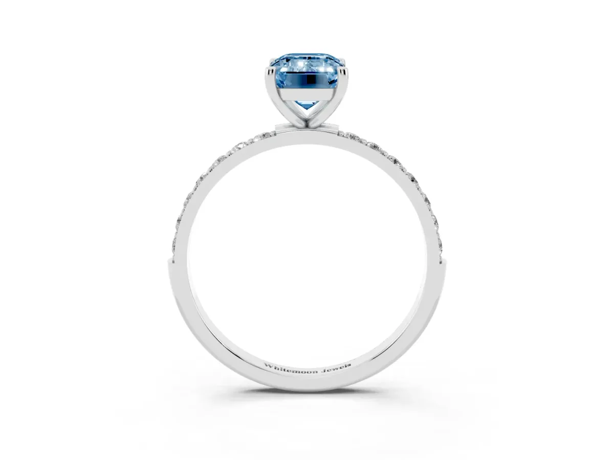 Fancy Blue Emerald Cut Diamond Solitaire Ring with Round Pavé Shoulders and Prong Setting Platinum