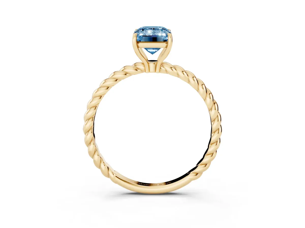 Fancy Blue Emerald Cut Solitaire Twist Band Ring with Four-Prong Setting Yellow gold