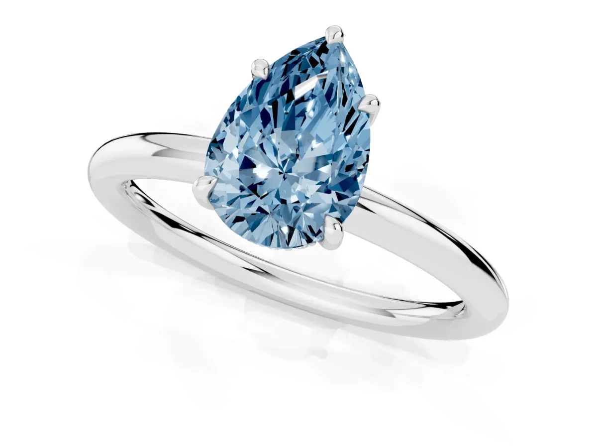 Fancy Blue Pear Cut Diamond Solitaire Ring with Thin Band and Four-Prong Setting Silver