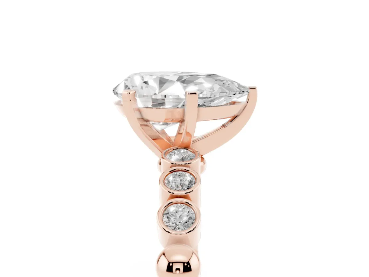 Pear Cut Solitaire Bezel Accent Diamond Engagement Ring with Beaded Band and Four-Prong Setting Rose gold