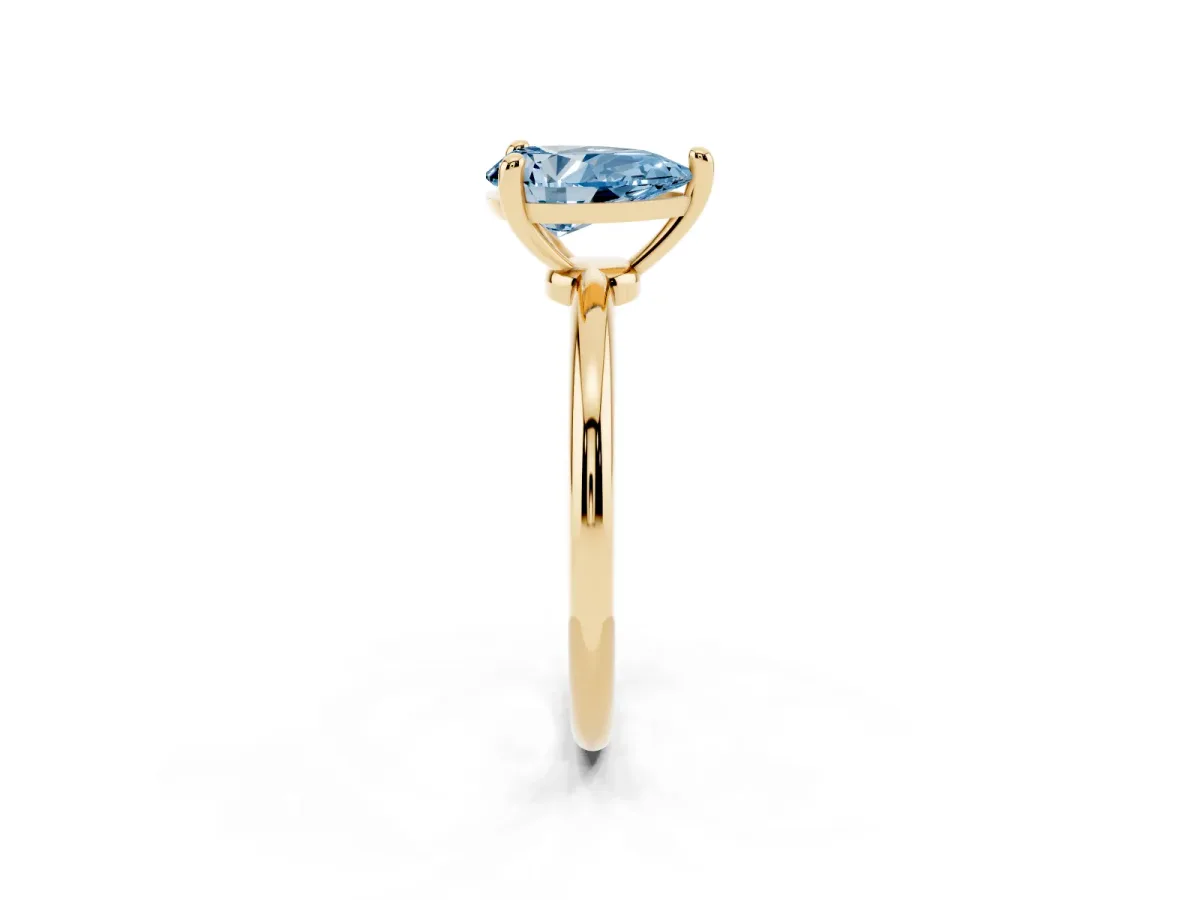 Fancy Blue Pear Cut Solitaire Diamond Ring with 4-Prong Setting on a Classic Band Yellow gold