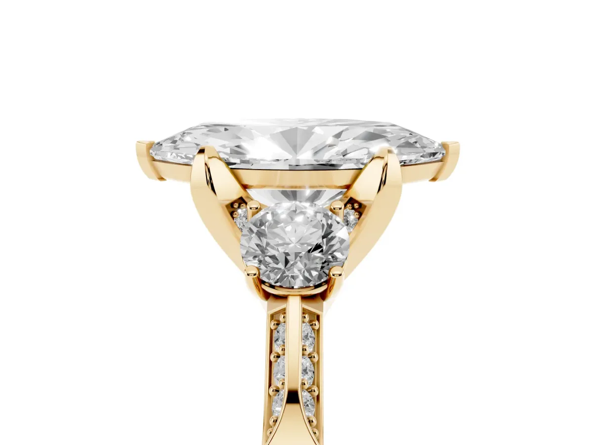 Marquise Cut Brilliant Three-Stone Diamond Ring with Pavé Band and Four-Prong Setting Yellow gold