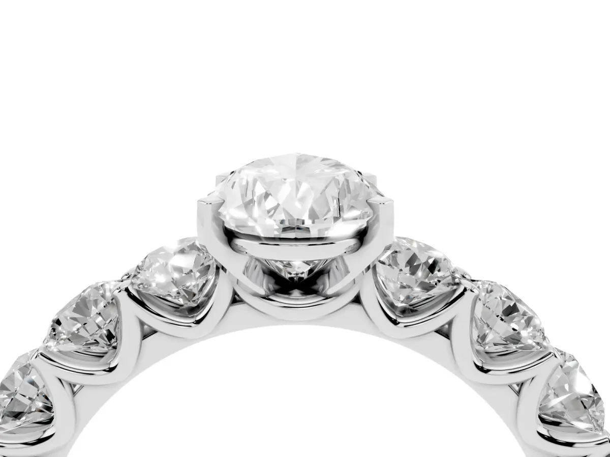Pear Cut Diamond Prong Setting with Side Stones on a Pave Band Silver