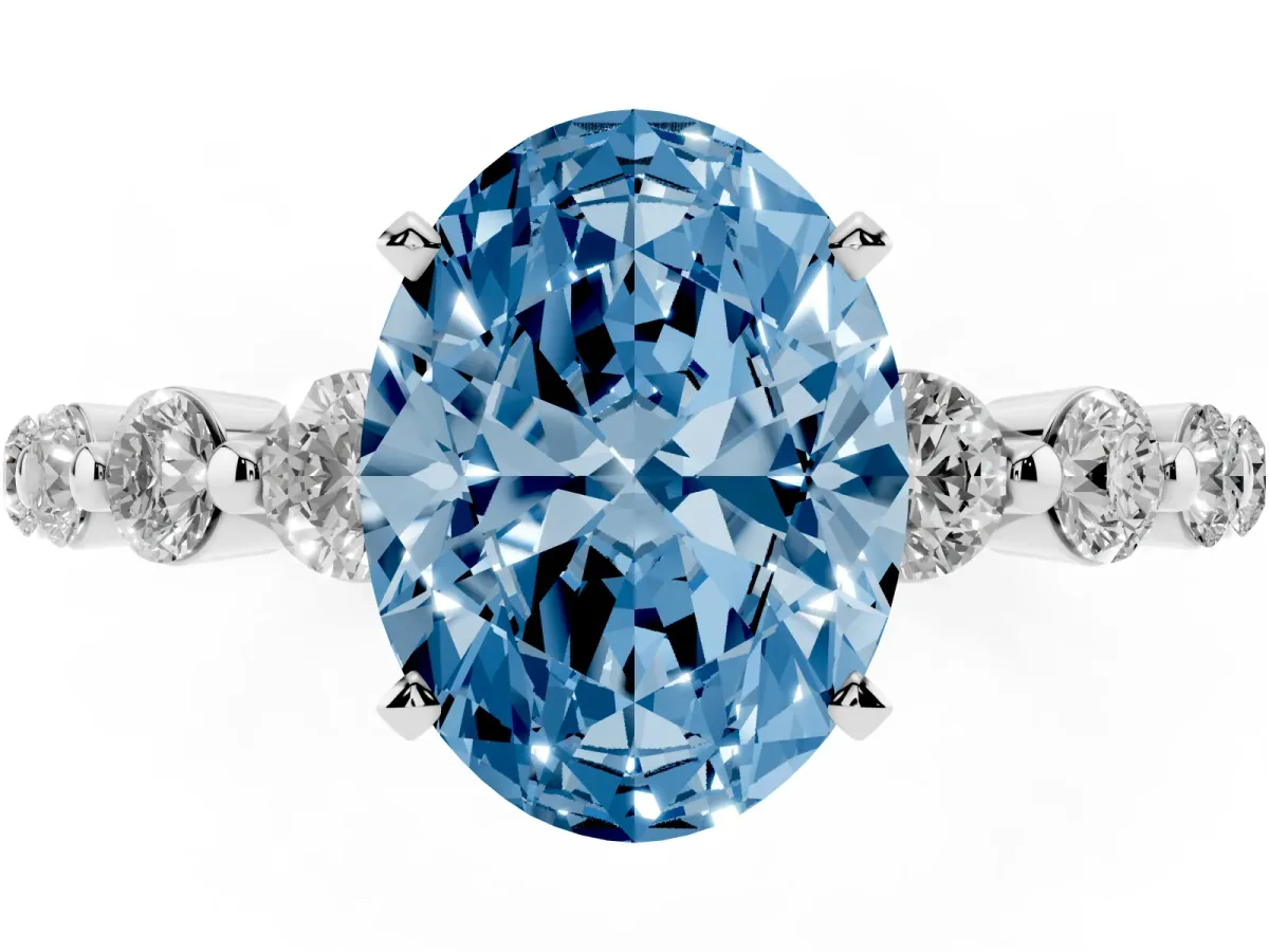 Fancy Blue Oval Cut Solitaire Diamond Ring with Pave Band and Four-Prong Setting Silver