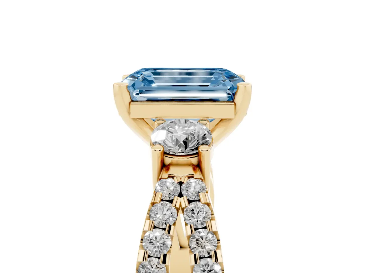 Fancy Blue Emerald Cut Diamond Three-Stone Ring with Pavé Split Shank and Four-Prong Setting Yellow gold