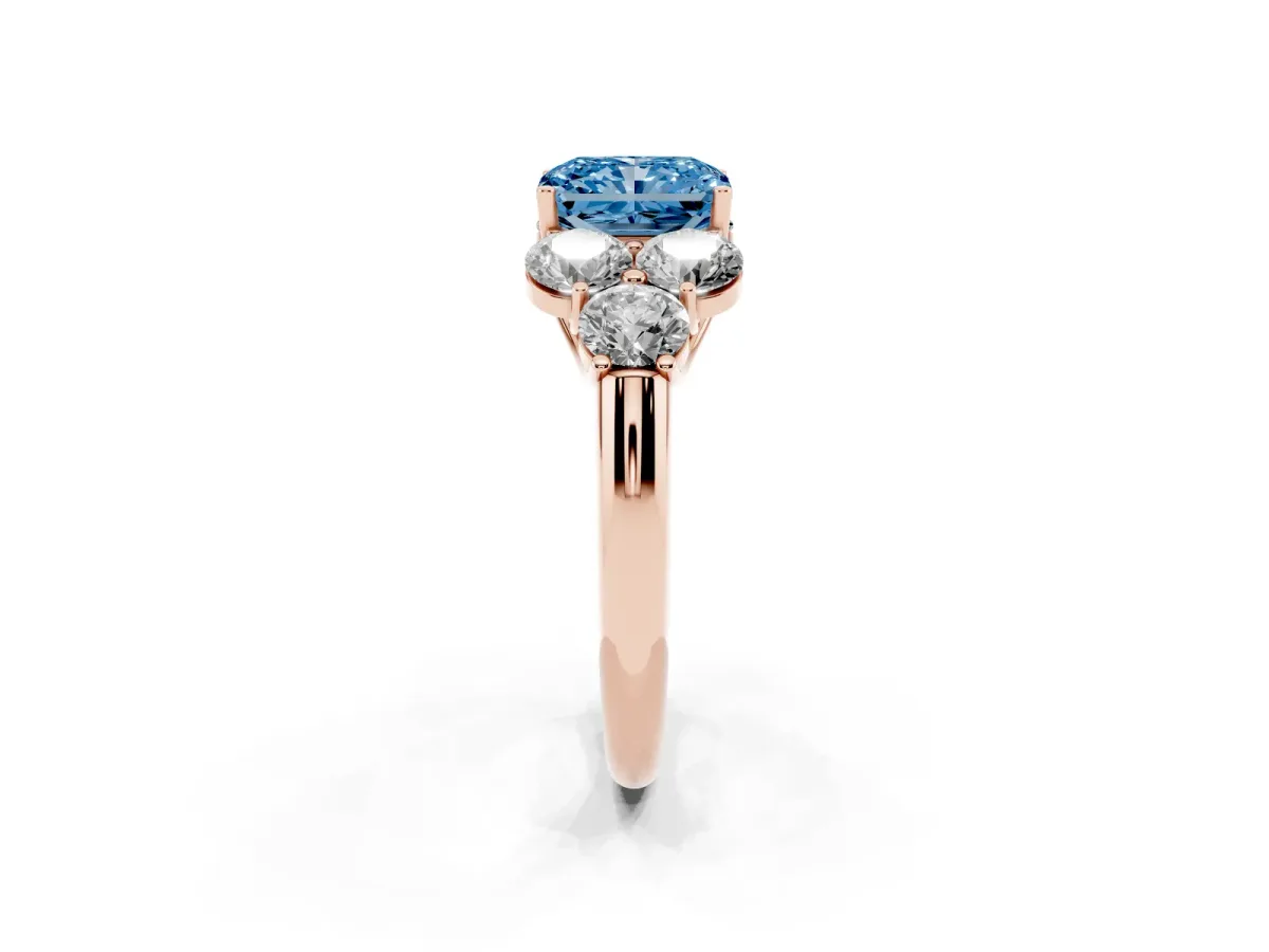 Fancy Blue Radiant Cut Cut Diamond Cluster Ring with Round Accent Stones and Prong Setting on a Classic Band Rose gold