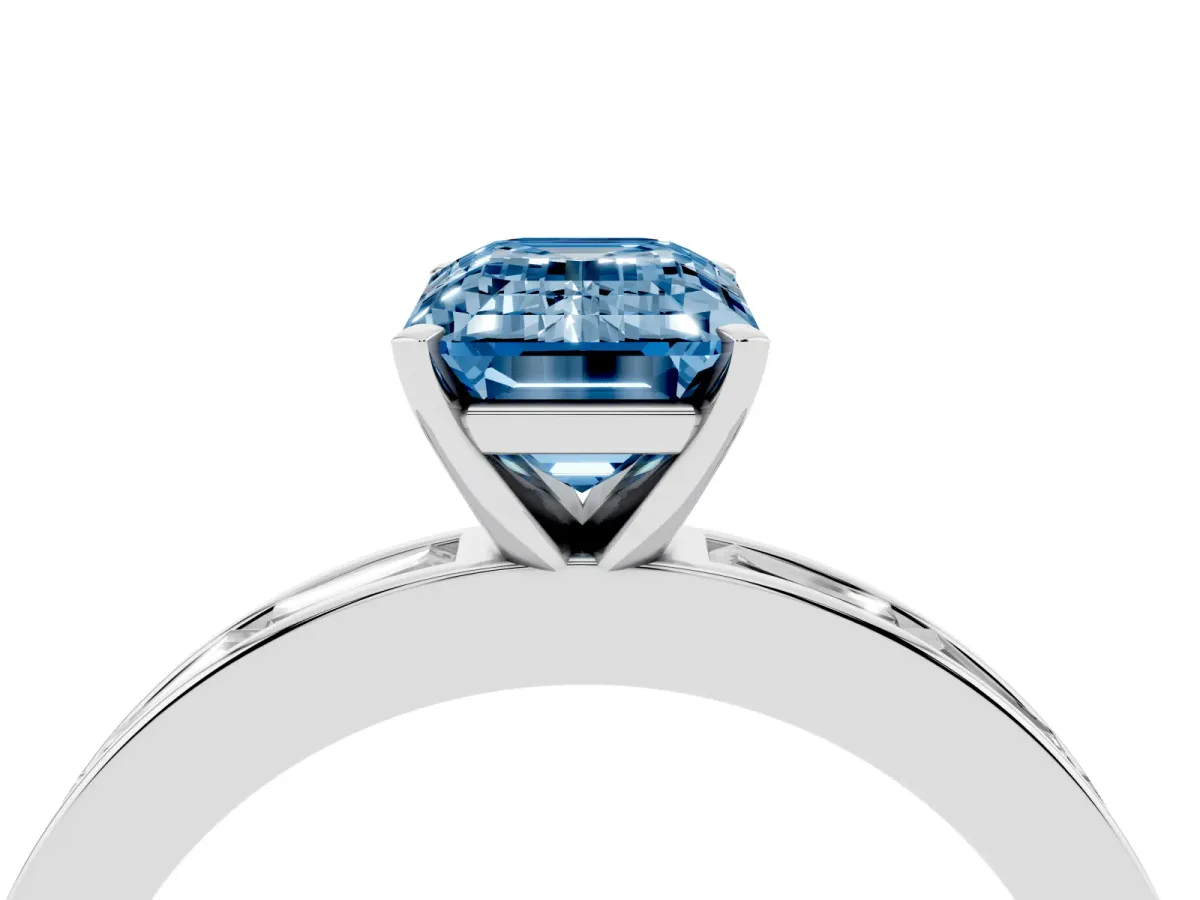 Fancy Blue Emerald Cut Solitaire Diamond Ring with Channel-Set Baguette Band and Four-Prong Setting White gold