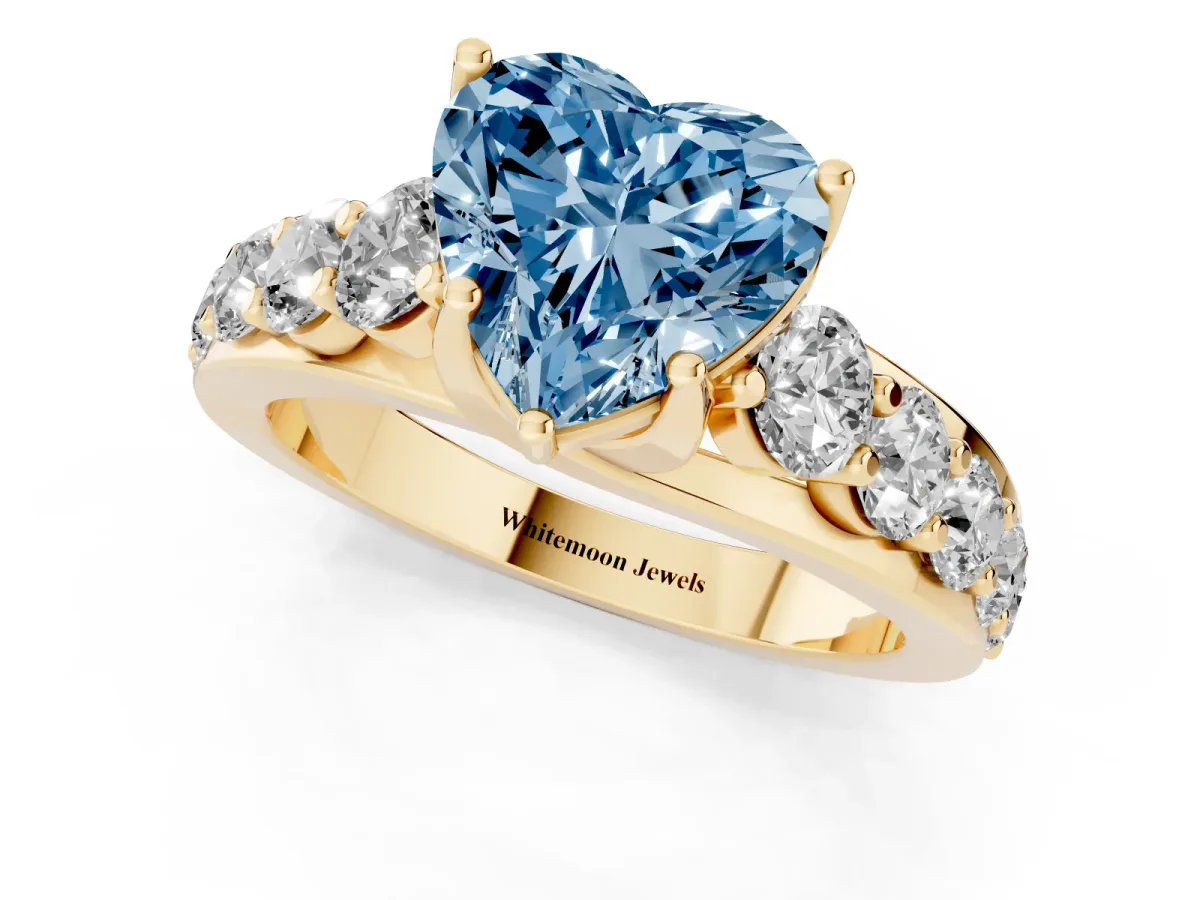 Fancy Blue Heart Cut Diamond Engagement Ring with Pavé Band and Four-Prong Setting Yellow gold