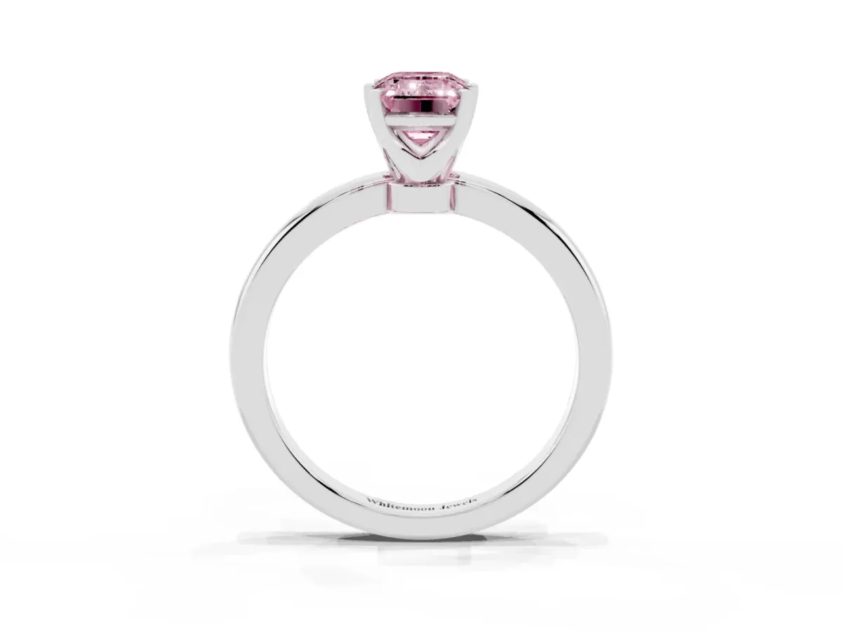Fancy Pink Emerald Cut Solitaire Diamond Ring with Six-Prong Setting on a Classic Band Platinum