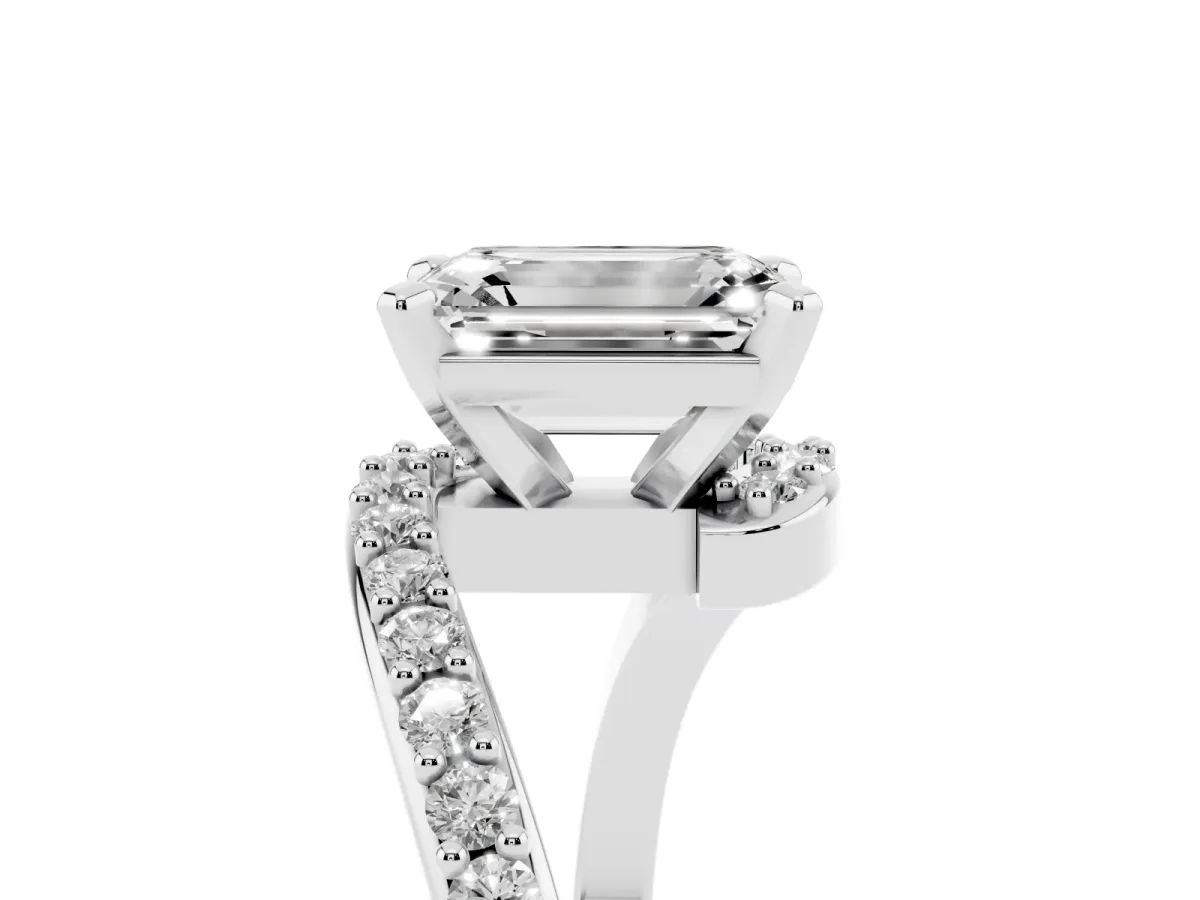 Emerald Cut Solitaire Twist Band with Pave Set Diamonds and Four-Prong Setting Silver