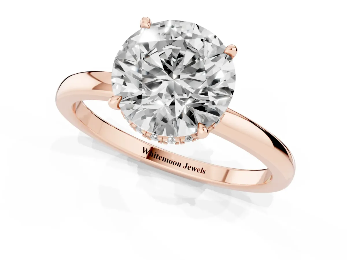 Round Cut Solitaire Engagement Ring with Cathedral Band and Four-Prong Setting Rose gold