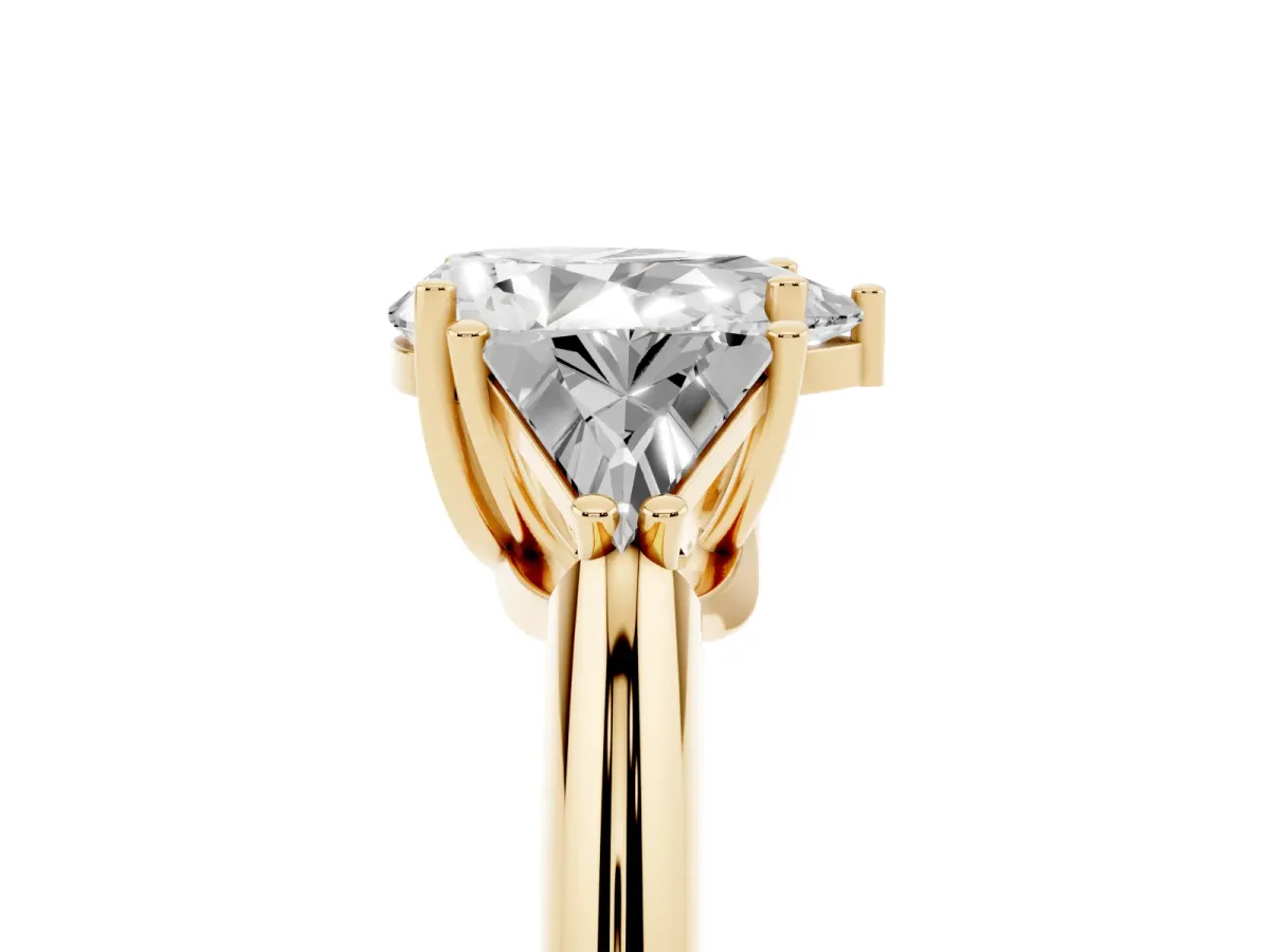 Three-Stone Pear Cut Diamond Engagement Ring with Trillion Side Stones and Prong Setting Yellow gold