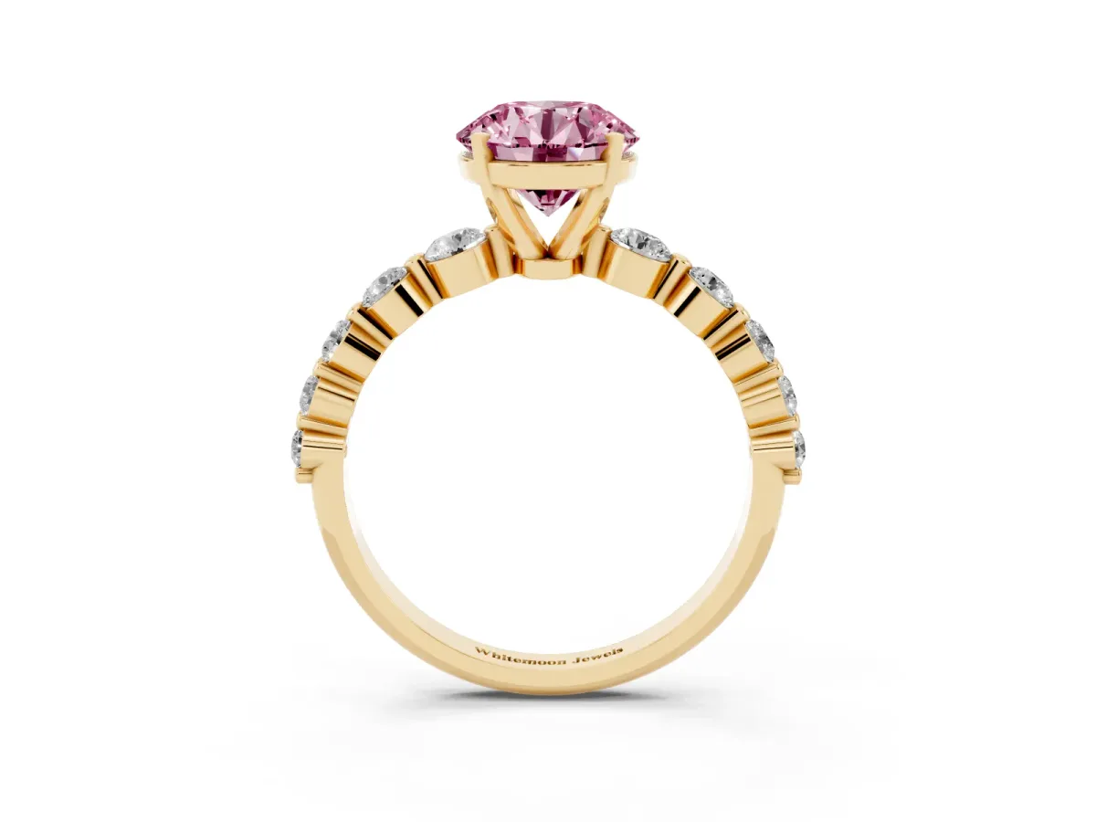 Fancy Pink Round Cut Solitaire Diamond Ring with Pave Band and Four-Prong Setting Yellow gold