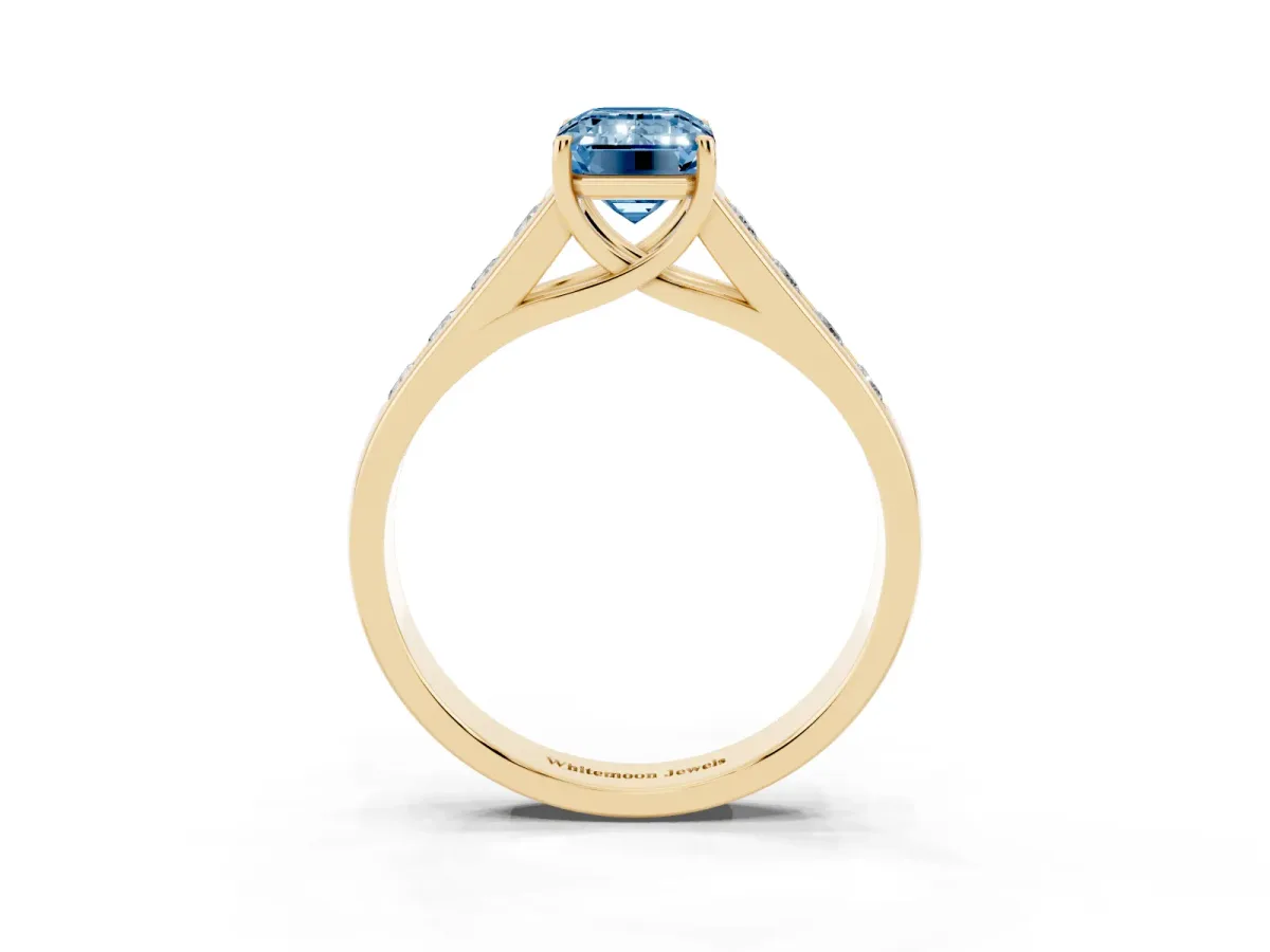 Fancy Blue Emerald Cut Solitaire Channel-Set Diamond Engagement Ring with Four-Prong Setting Yellow gold