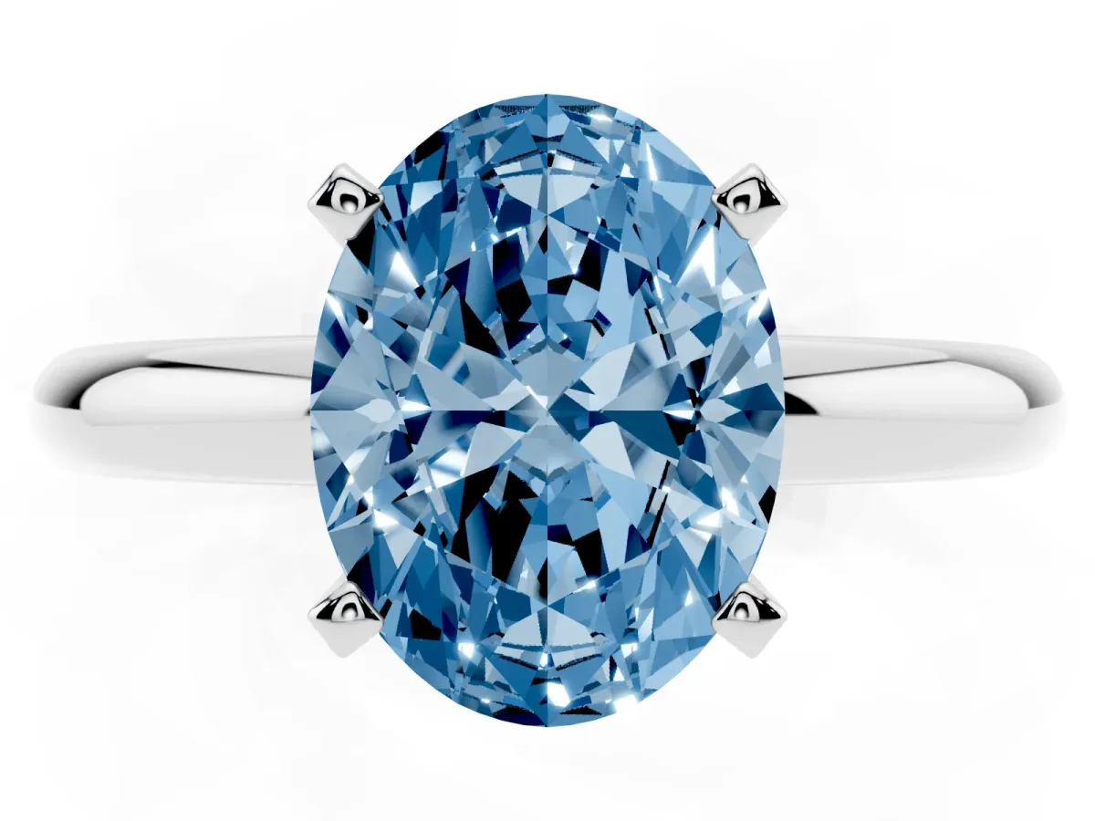Fancy Blue Oval Cut Diamond Solitaire Engagement Ring with Round Band and Four-Prong Setting Platinum