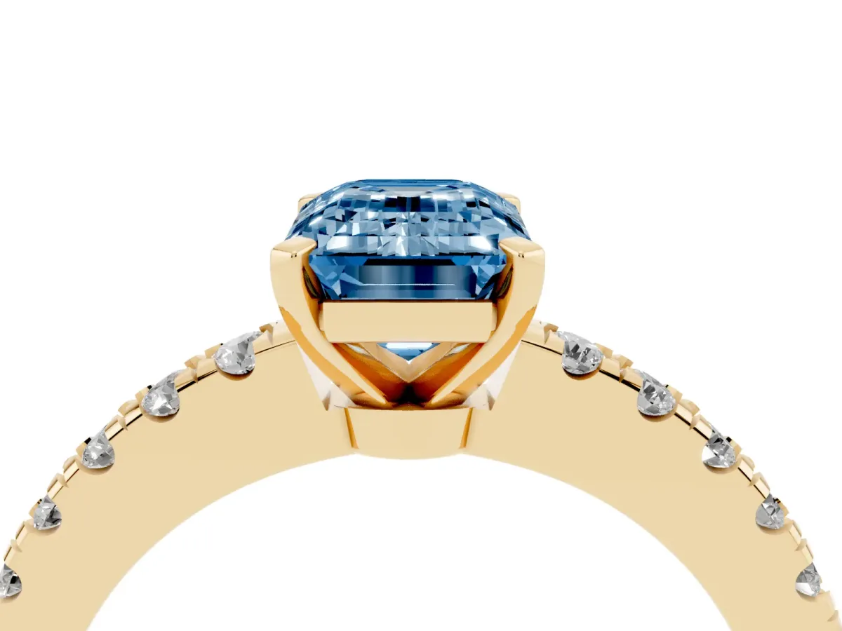Fancy Blue Emerald Cut Solitaire Diamond with Pavé Band and Four-Prong Setting Yellow gold