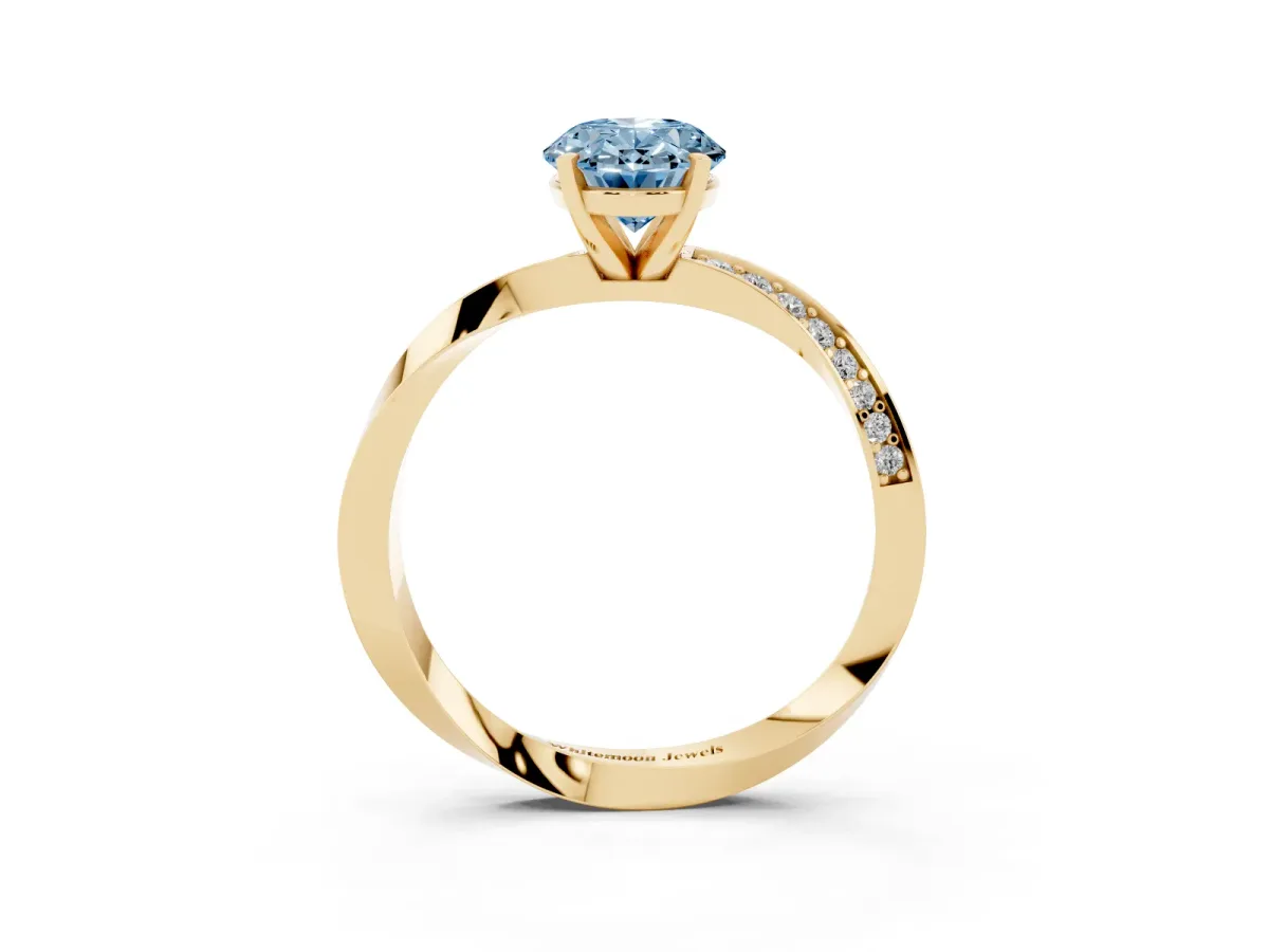 Fancy Blue Oval Cut Diamond Engagement Ring with Side Stone Accents and Four-Prong Setting Yellow gold