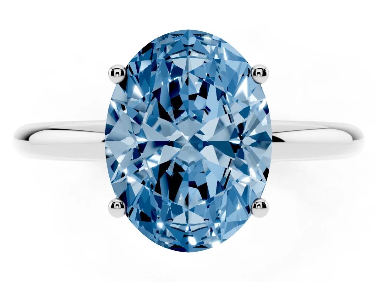 Fancy Blue Oval Cut Cut Solitaire Engagement Ring with Four-Prong Setting and Classic Band Silver