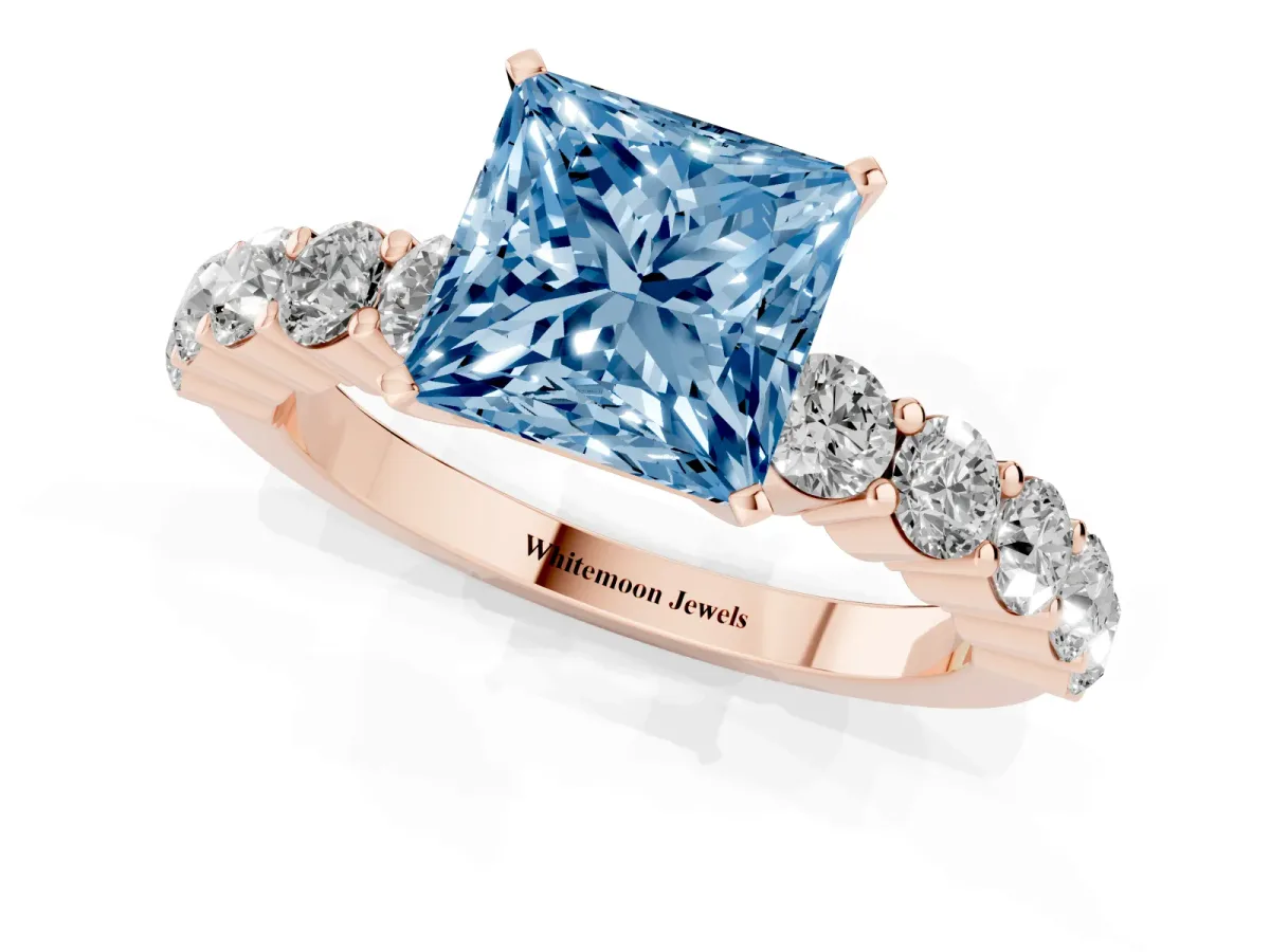 Fancy Blue Princess Cut Diamond Solitaire Ring with Shared Prong Round Side Stones Rose gold