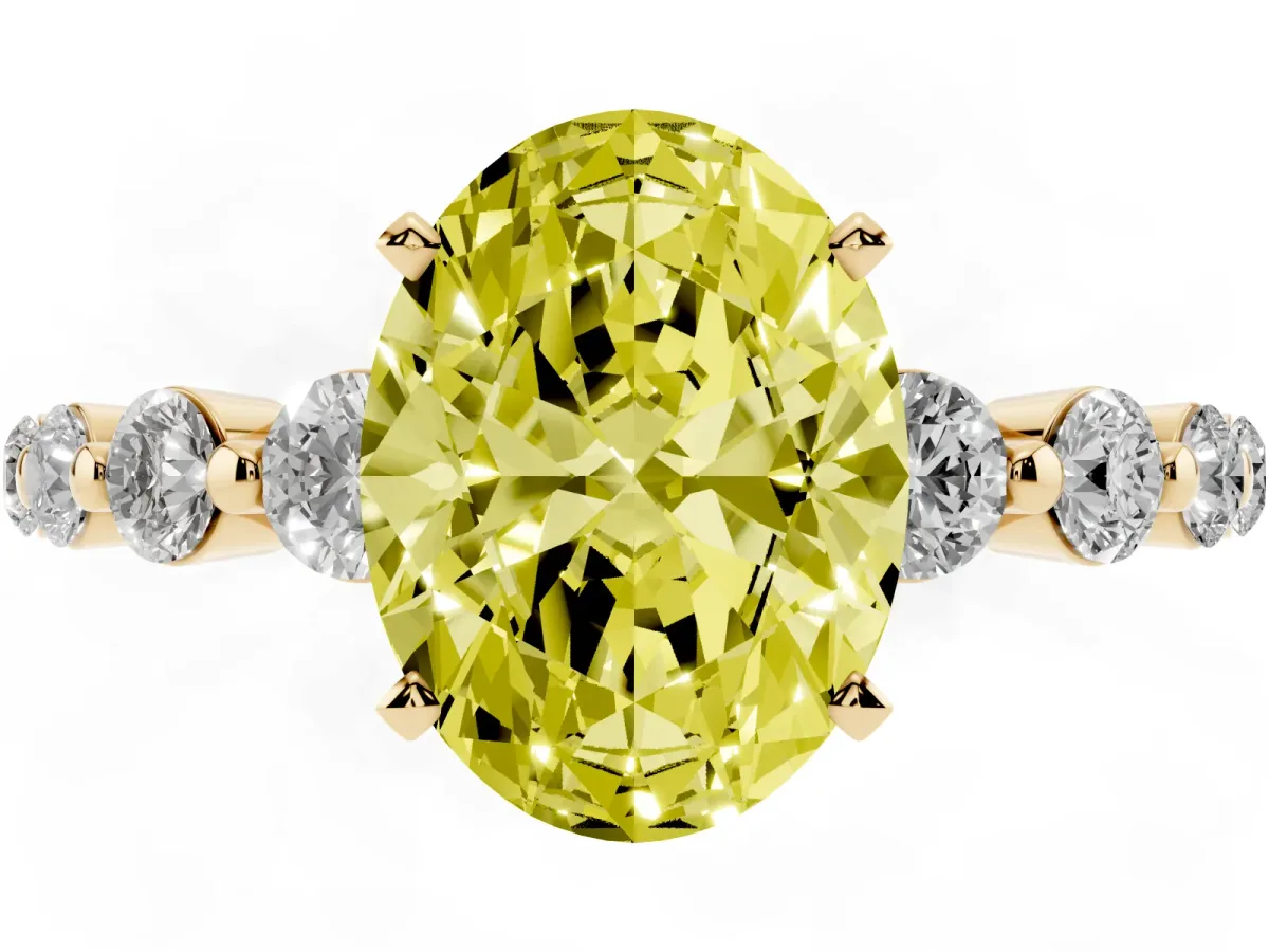 Fancy Yellow Oval Cut Solitaire Diamond Ring with Pave Band and Four-Prong Setting Yellow gold