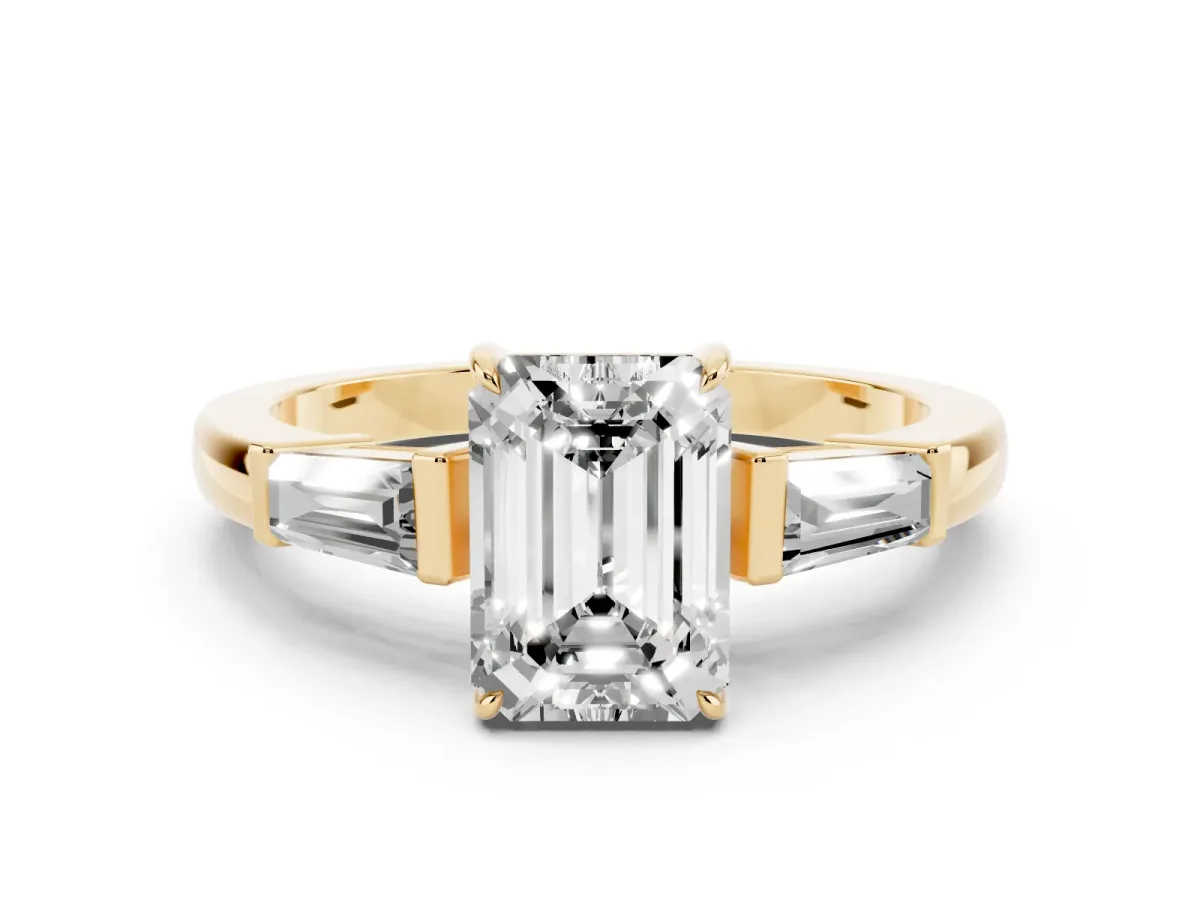 Emerald Cut Diamond Three-Stone Ring with Tapered Baguette Side Stones and Prong Setting Yellow gold