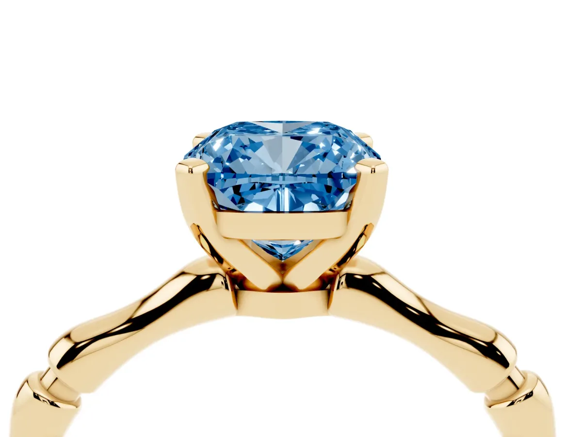 Fancy Blue Cushion Cut Solitaire Diamond Ring with Bamboo Band and Four-Prong Setting Yellow gold