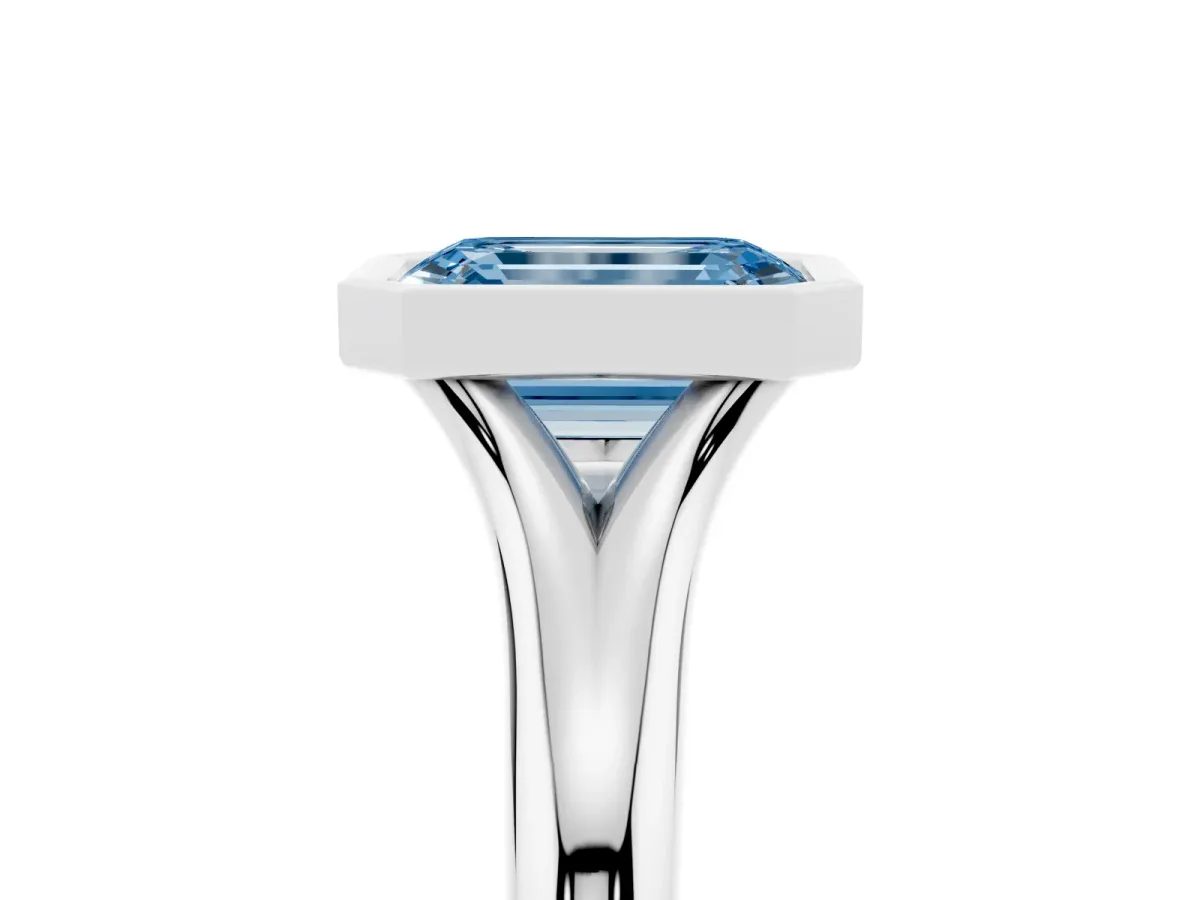 Fancy Blue Bezel Set Emerald Cut Solitaire Diamond Ring with Smooth Band Silver