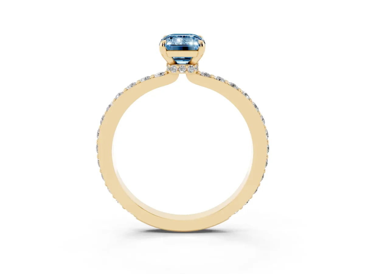 Fancy Blue Emerald Cut Diamond Solitaire Engagement Ring with Pavé Band and Four-Prong Setting Yellow gold