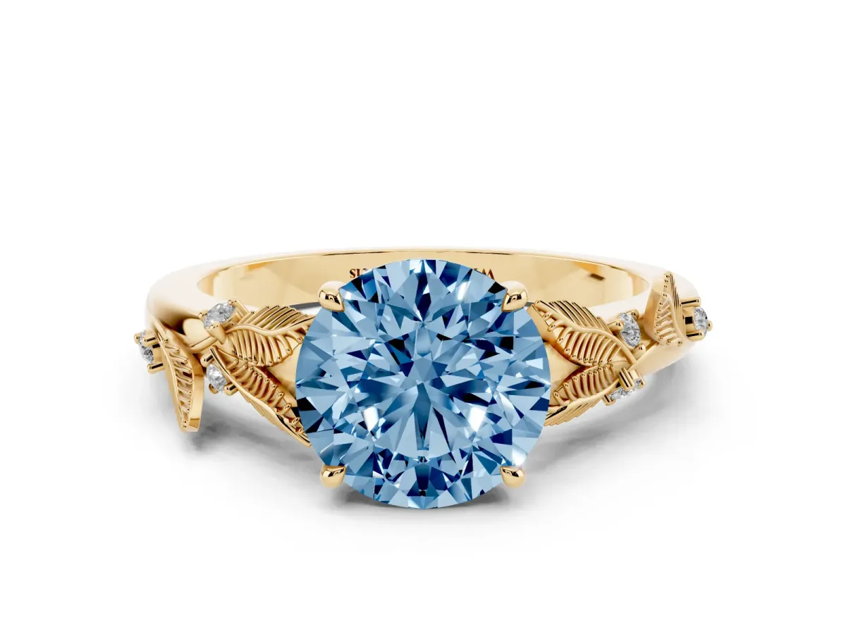 Fancy Blue Round Cut Diamond Solitaire Ring with Leaf Motif Band and Four-Prong Setting Yellow gold