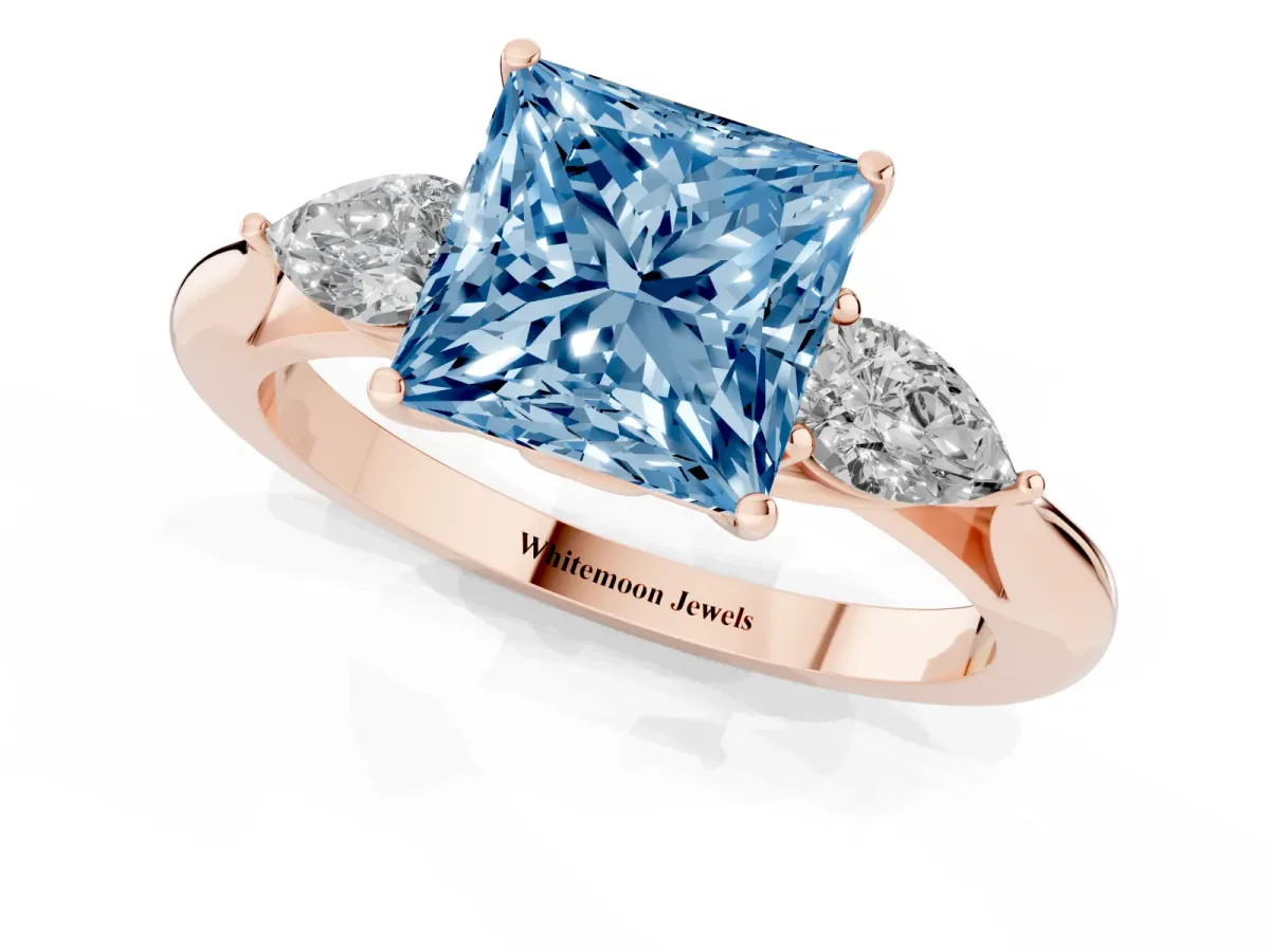 Fancy Blue Princess Cut Diamond Three-Stone Ring with Pear Side Stones and Prong Setting Rose gold