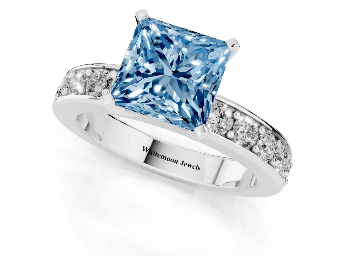 Fancy Blue Princess Cut Diamond Engagement Ring with Channel Set Round Band and Prong Setting Silver