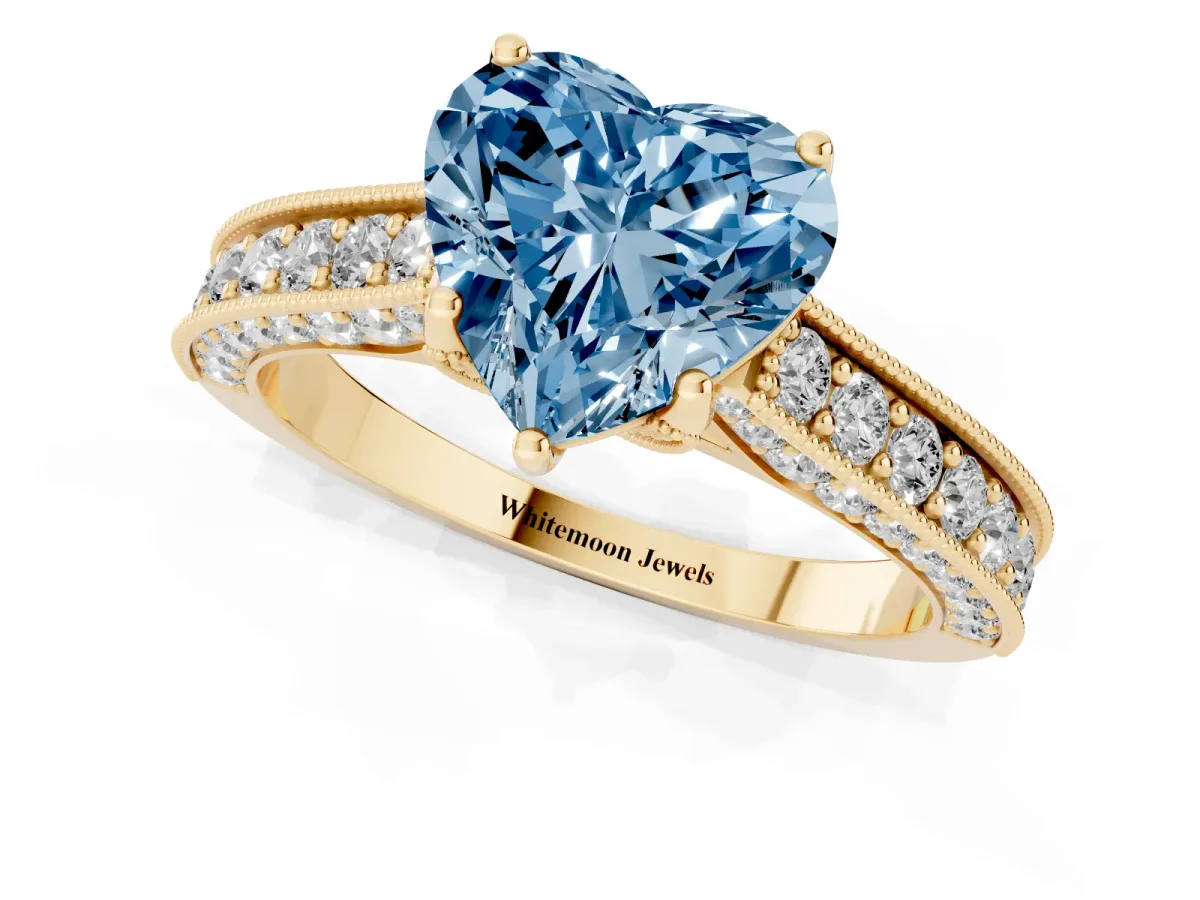 Fancy Blue Heart Cut Cut Diamond Solitaire Ring with Milgrain Pave Band and Four Prong Setting Yellow gold