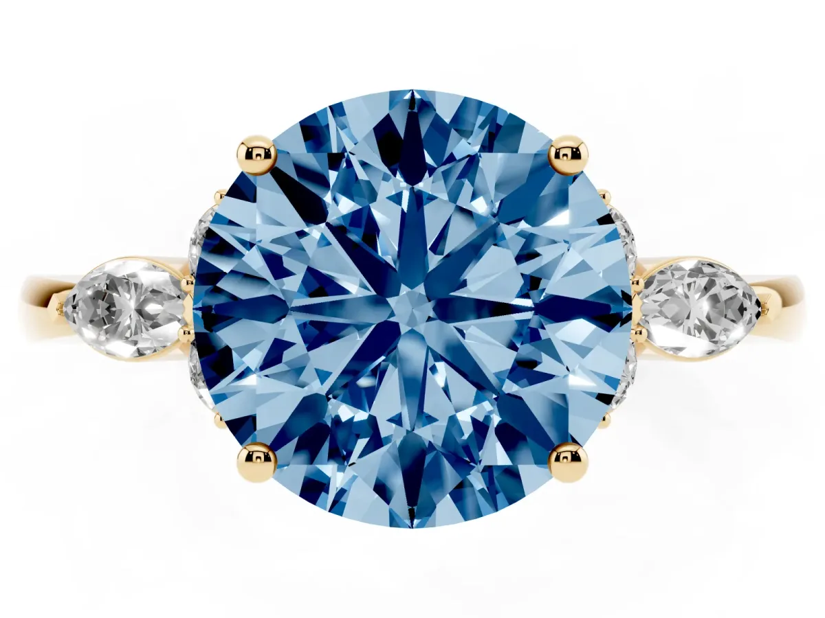 Fancy Blue Round Cut Brilliant Diamond Solitaire Ring with Pear Side Stones and Four-Prong Setting Yellow gold