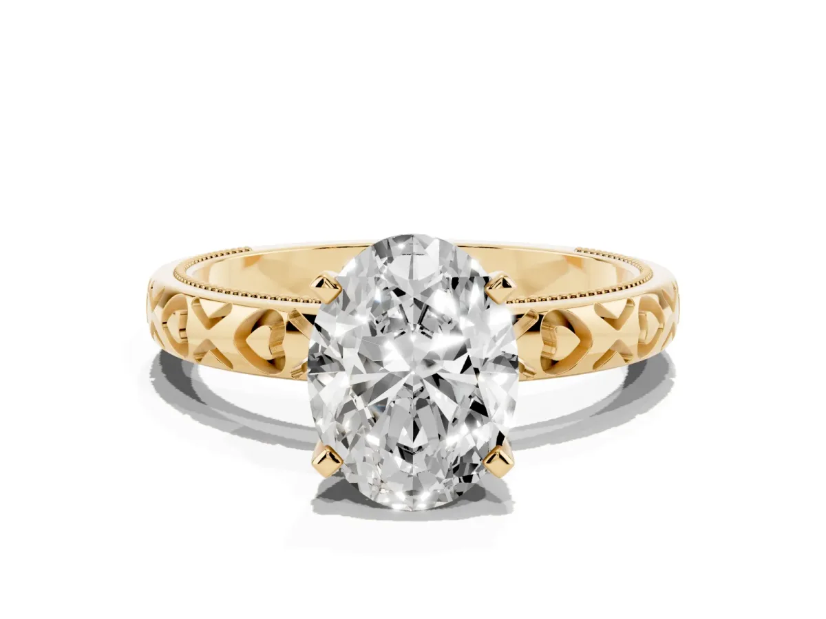 Oval Cut Solitaire Diamond Engagement Ring with XO Engraved Band and Four-Prong Setting Yellow gold